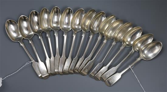 A part set of fifteen Victorian silver fiddle pattern dessert spoons 23 oz.